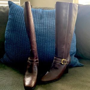 Brown boots with buckle.